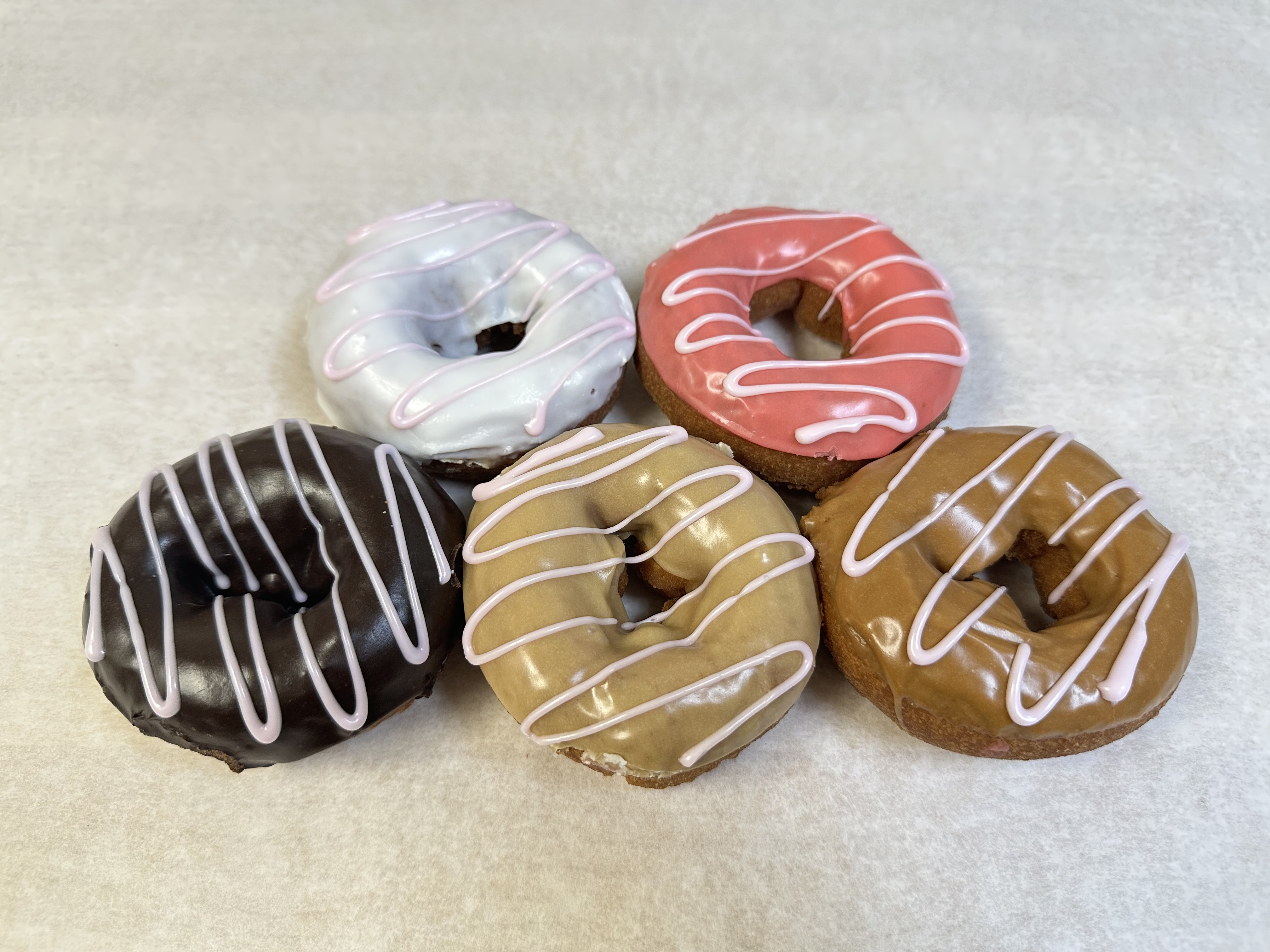 Cake donuts with colorful drizzle